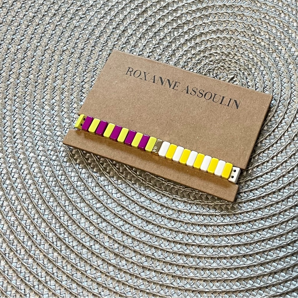 Roxanne Assoulin Enamel coated stretch bracelet with a gold tone logo